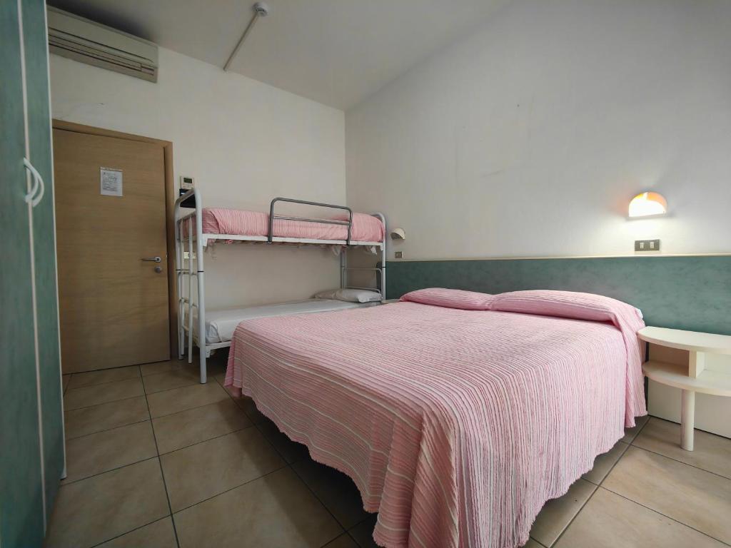 Postel nebo postele na pokoji v ubytování Hotel Ben Hur