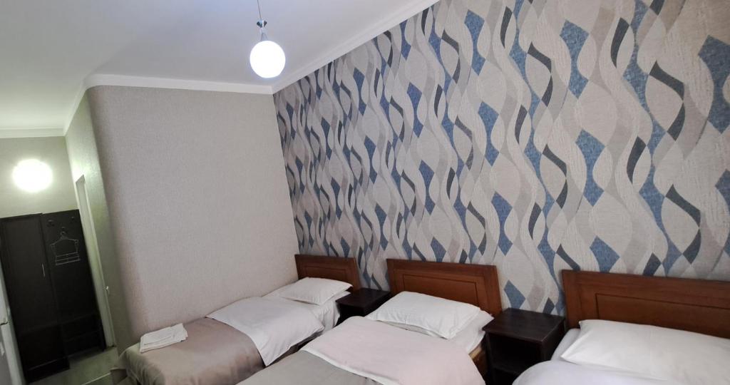 Postel nebo postele na pokoji v ubytování Sighnaghi Central