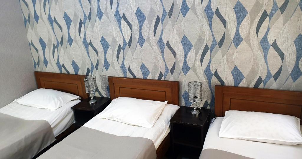 Postel nebo postele na pokoji v ubytování Sighnaghi Central