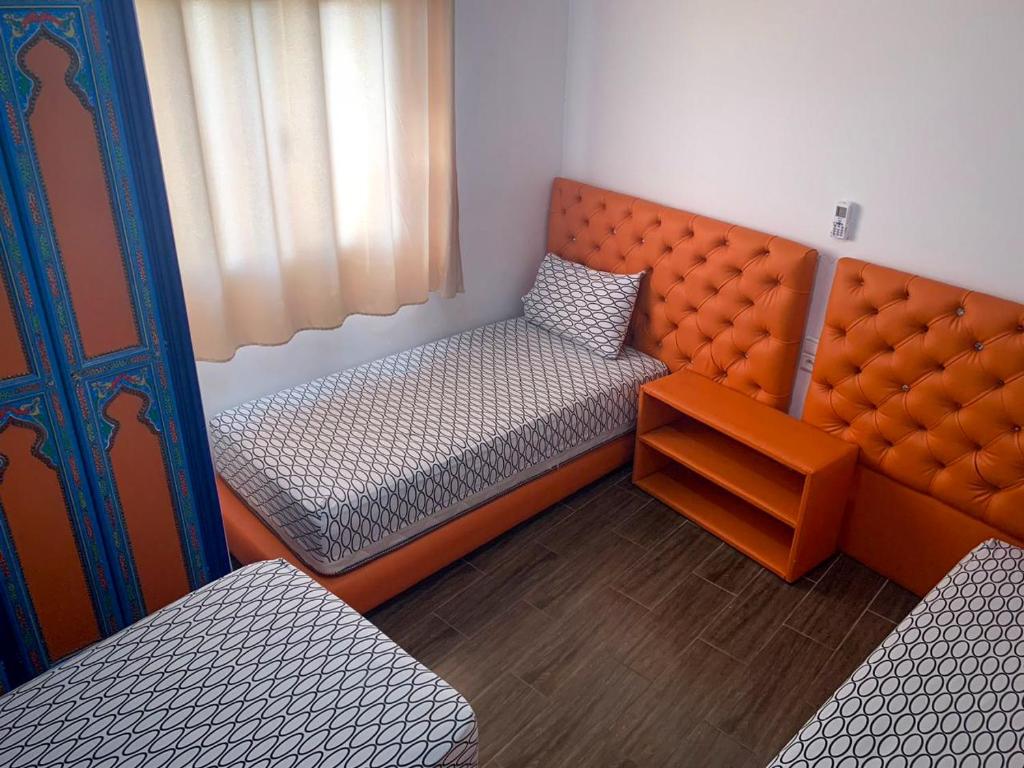 Postel nebo postele na pokoji v ubytování Dar Saida Hora