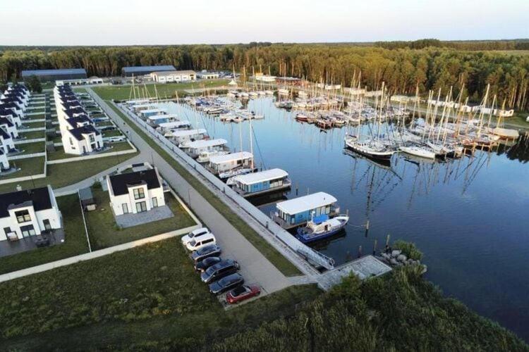 an aerial view of a marina with boats in the water at Ferienhaus am Yachthafen in Peenemünde in Peenemünde