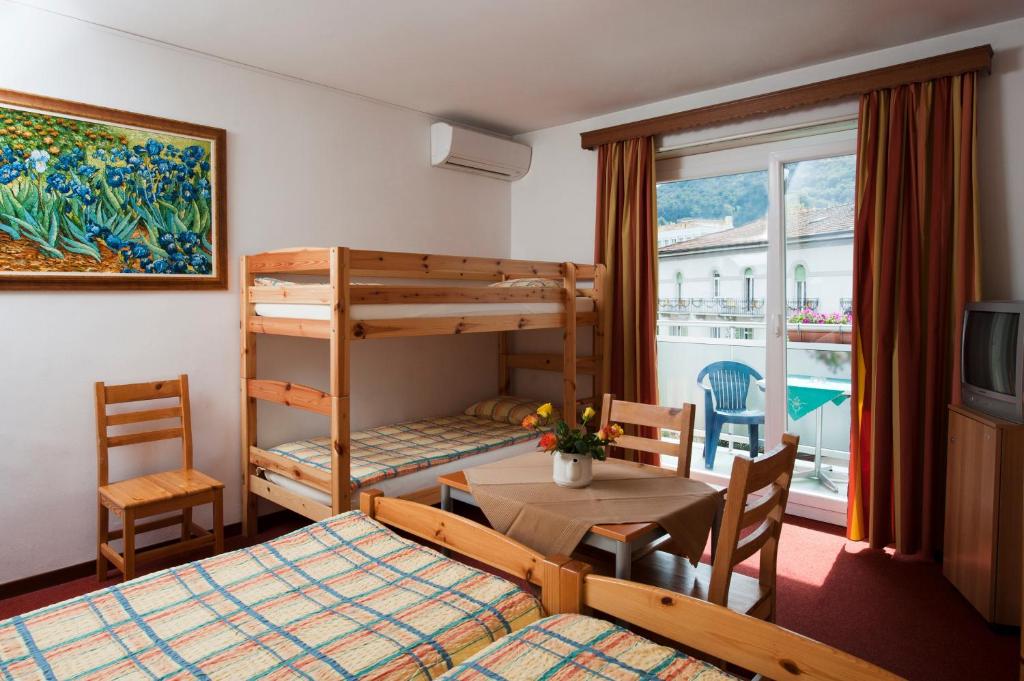 Postel nebo postele na pokoji v ubytování Hotel Dischma - FREE BUS AND TRAIN TICKET