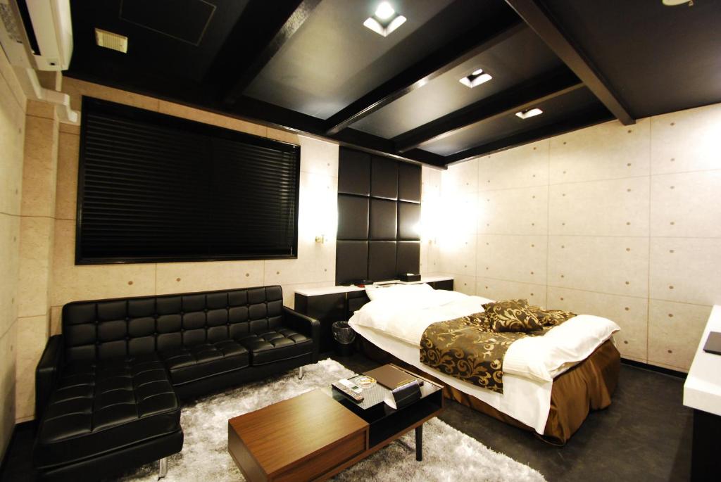 Postel nebo postele na pokoji v ubytování Hotel Free Style Okayama