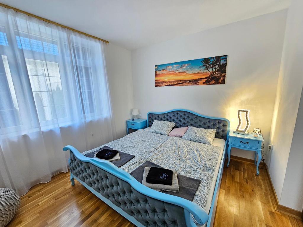 Postel nebo postele na pokoji v ubytování Vila Santorini Nacionalni Park Fruška Gora