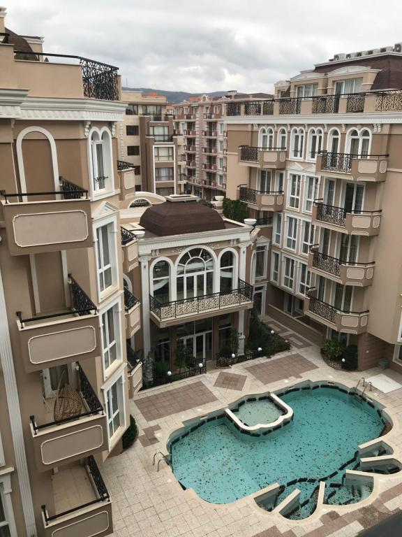 an aerial view of a building with a swimming pool at Cascadas Family Resort Complex entrance H apartment 20 in Sunny Beach