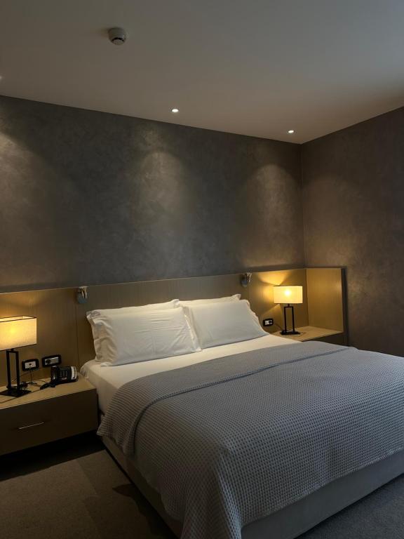 Postel nebo postele na pokoji v ubytování Hotel Driloni