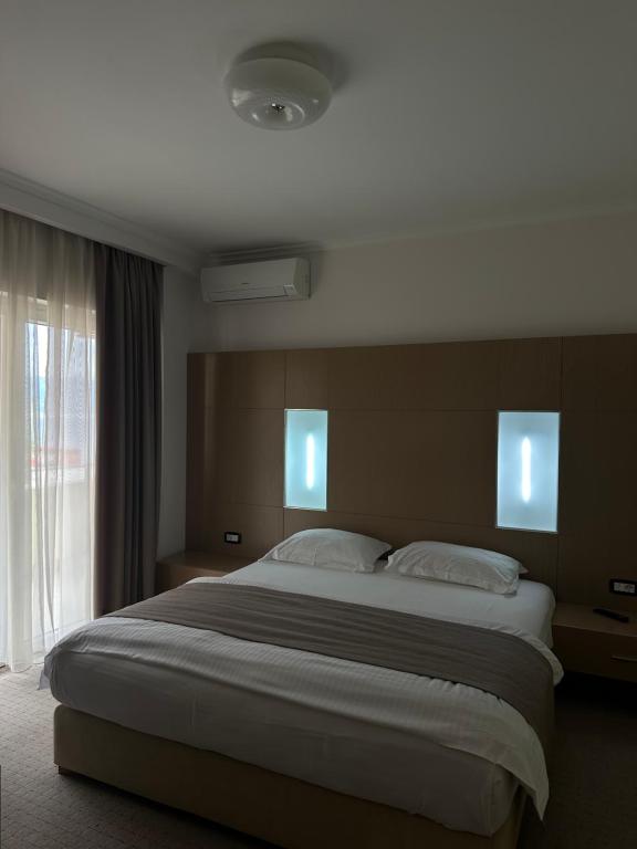 Postel nebo postele na pokoji v ubytování Hotel Driloni