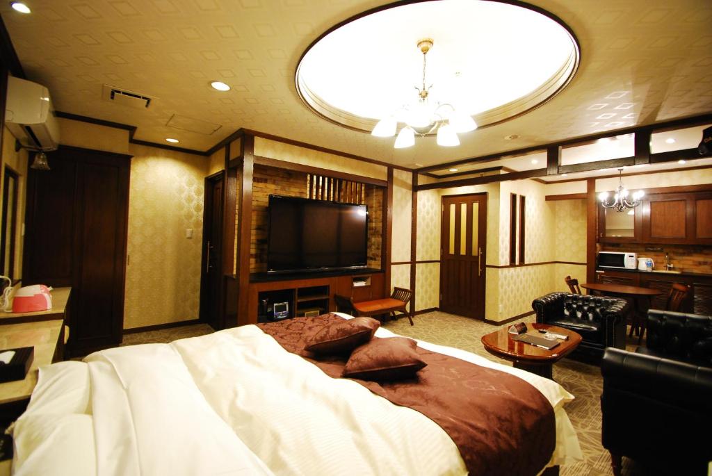 Postel nebo postele na pokoji v ubytování Hotel Free Style Okayama