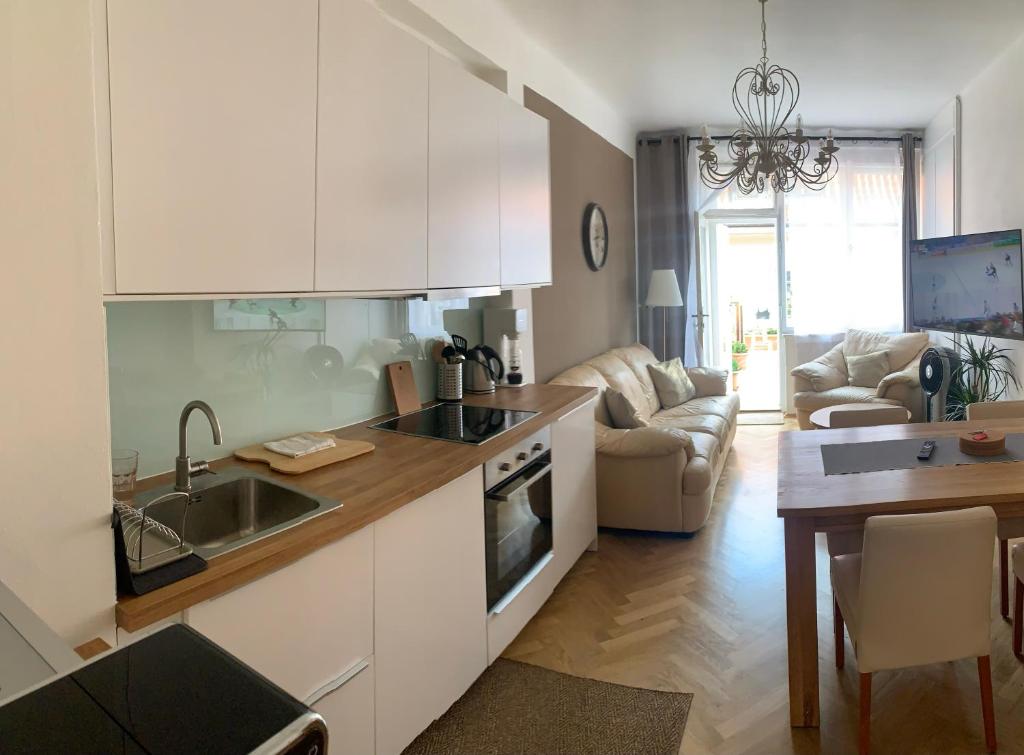 a kitchen with a sink and a counter top at Anenska by Charles Bridge 3 in Prague