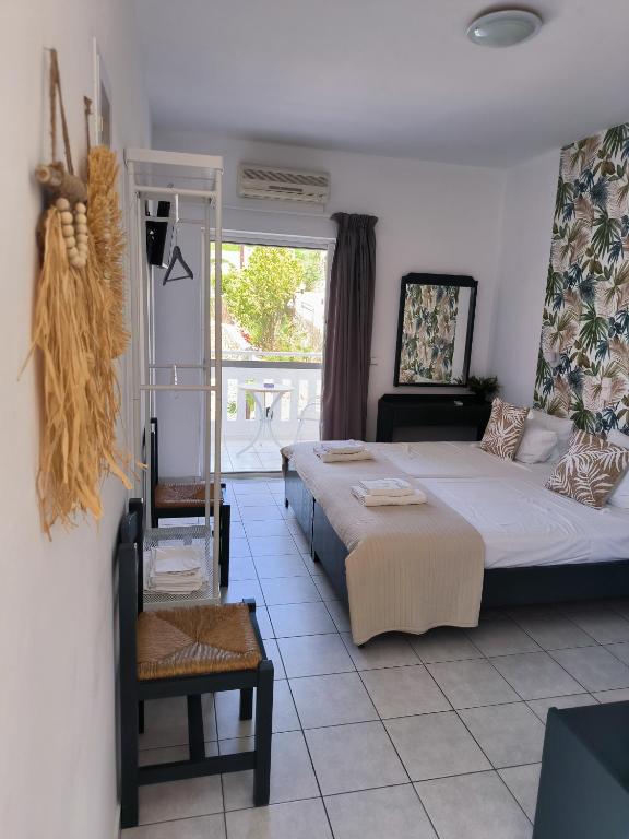Postel nebo postele na pokoji v ubytování Cost Mari Almyrida New by ZAGO Boutiqe hotels