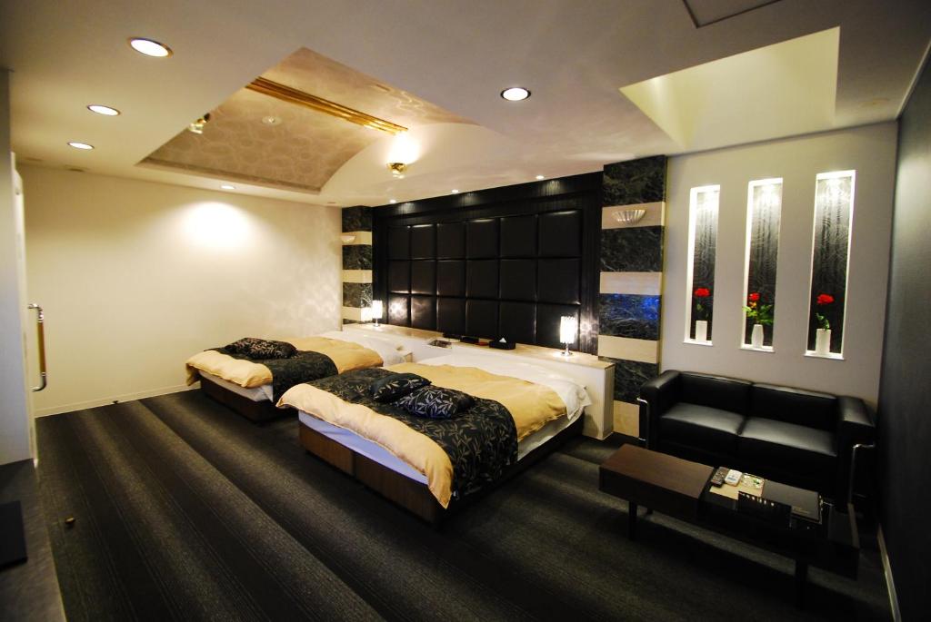 Postel nebo postele na pokoji v ubytování Hotel Free Style Okayama