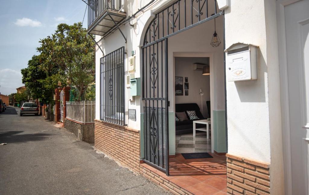 an entrance to a building with an iron gate at Mar y montaña in Monachil