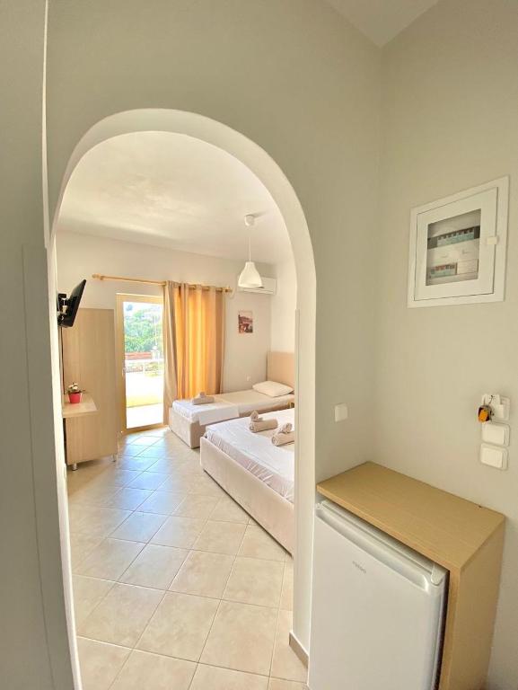 Postel nebo postele na pokoji v ubytování Foti Rooms