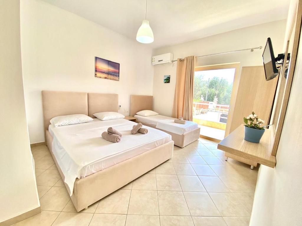 Postel nebo postele na pokoji v ubytování Foti Rooms