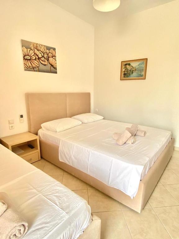 Postel nebo postele na pokoji v ubytování Foti Rooms
