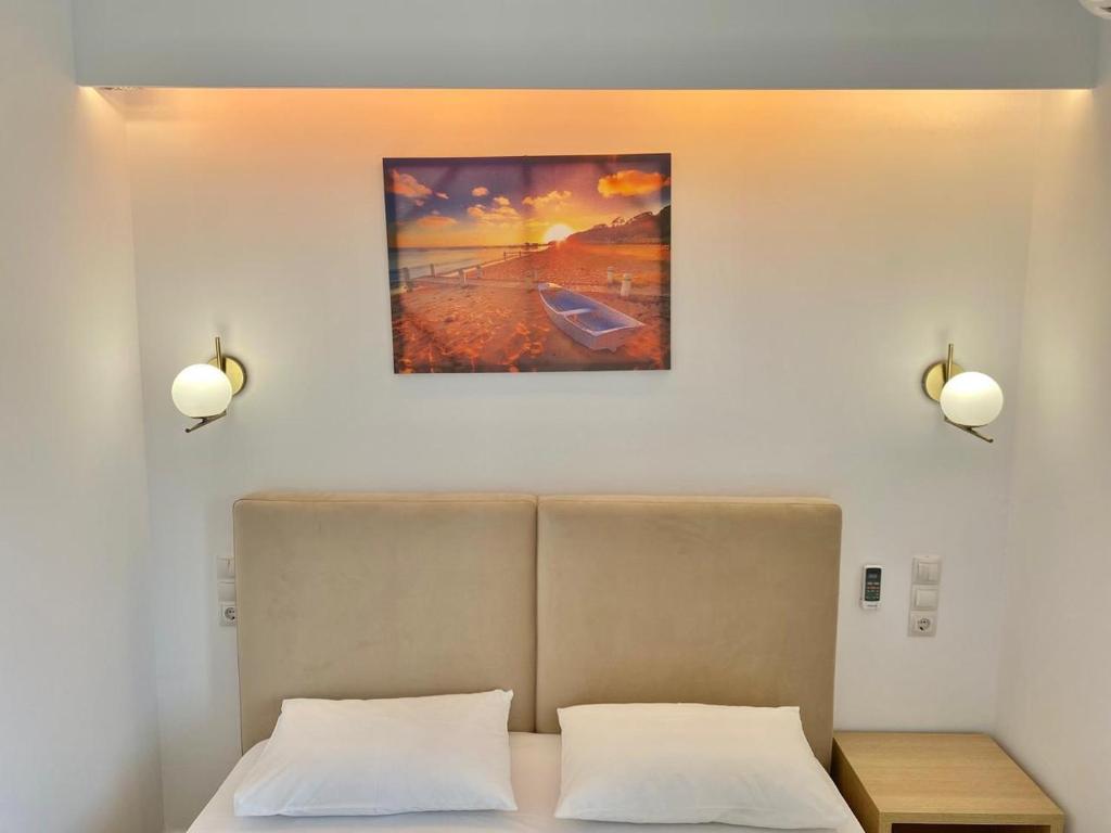 Postel nebo postele na pokoji v ubytování Foti Rooms