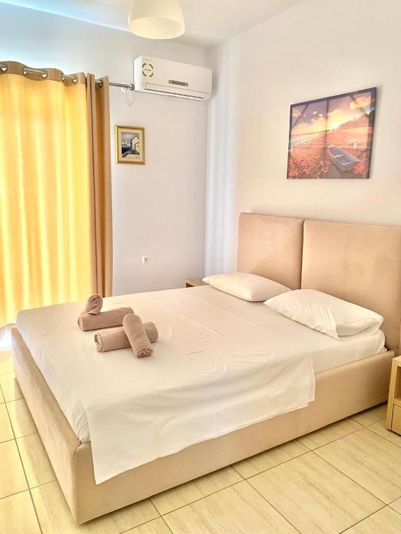 Postel nebo postele na pokoji v ubytování Foti Rooms