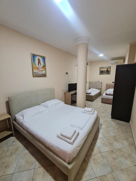Postel nebo postele na pokoji v ubytování Hotel La Villa