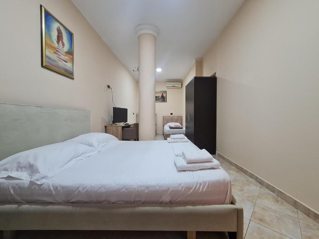 Postel nebo postele na pokoji v ubytování Hotel La Villa