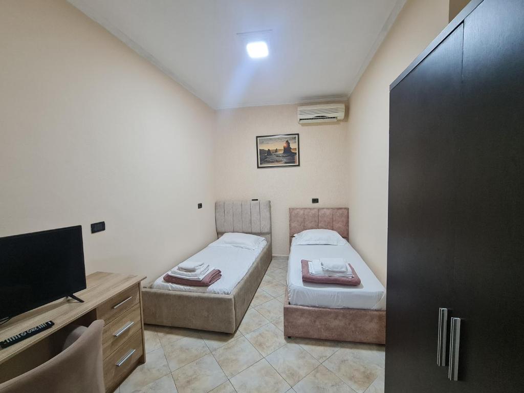 Postel nebo postele na pokoji v ubytování Hotel La Villa
