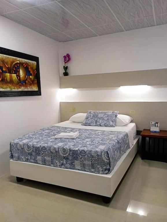 Postel nebo postele na pokoji v ubytování Hotel Los Algarrobos