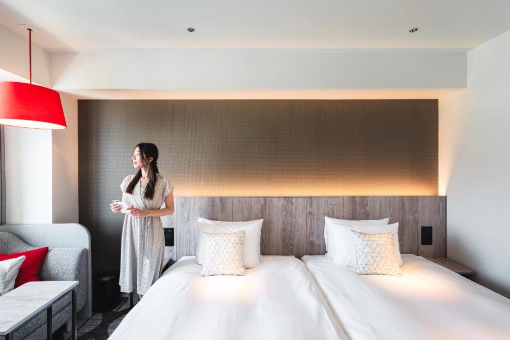 Postel nebo postele na pokoji v ubytování Hotel JAL City Toyama