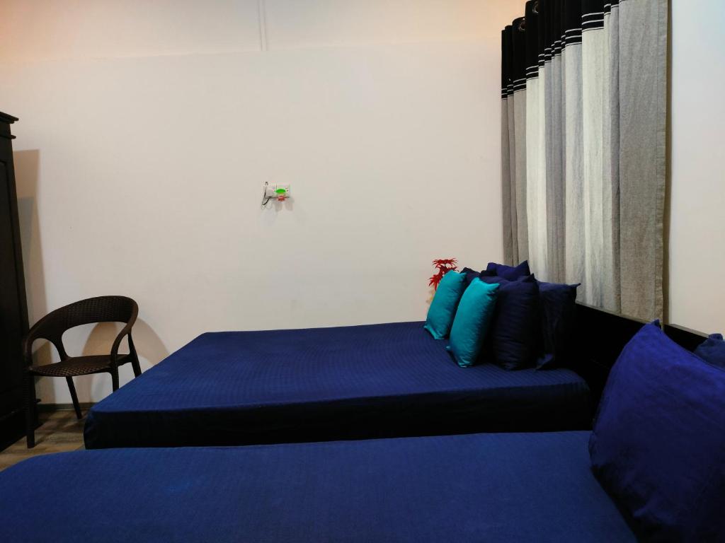 Postel nebo postele na pokoji v ubytování Taj Residence