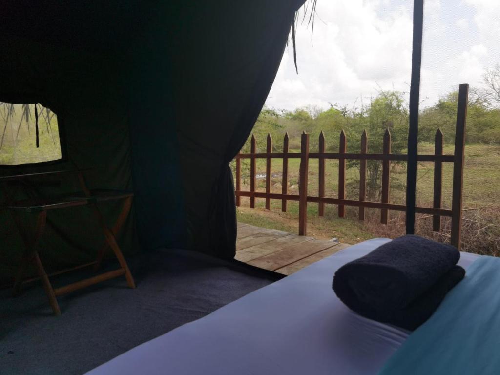 Postel nebo postele na pokoji v ubytování Basecamp - Yala