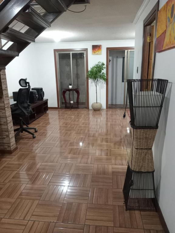 an empty room with a hard wood floor at La casa di Gio in Santiago