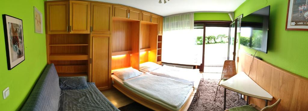 Postel nebo postele na pokoji v ubytování Bad Gastein Holiday Apartments
