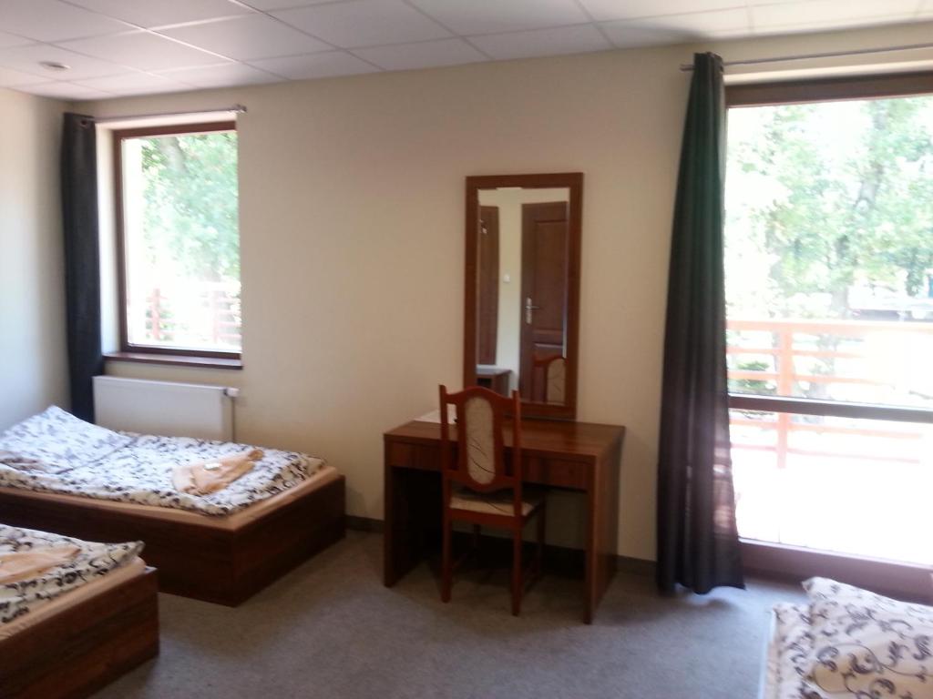 Postel nebo postele na pokoji v ubytování Hotel i Camping Tramp