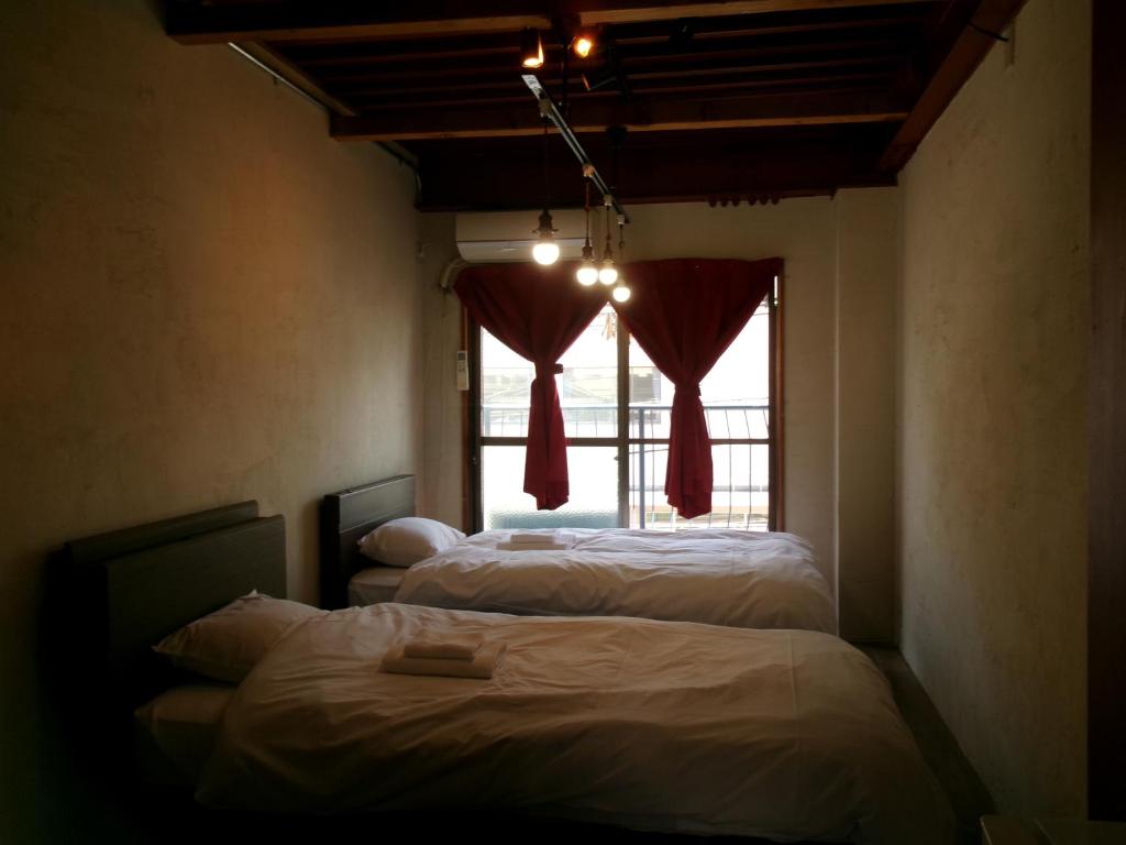 Postel nebo postele na pokoji v ubytování Lazy House