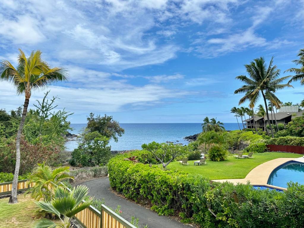 a view of the ocean from a resort at Ocean Breeze Kona Home in Kailua-Kona