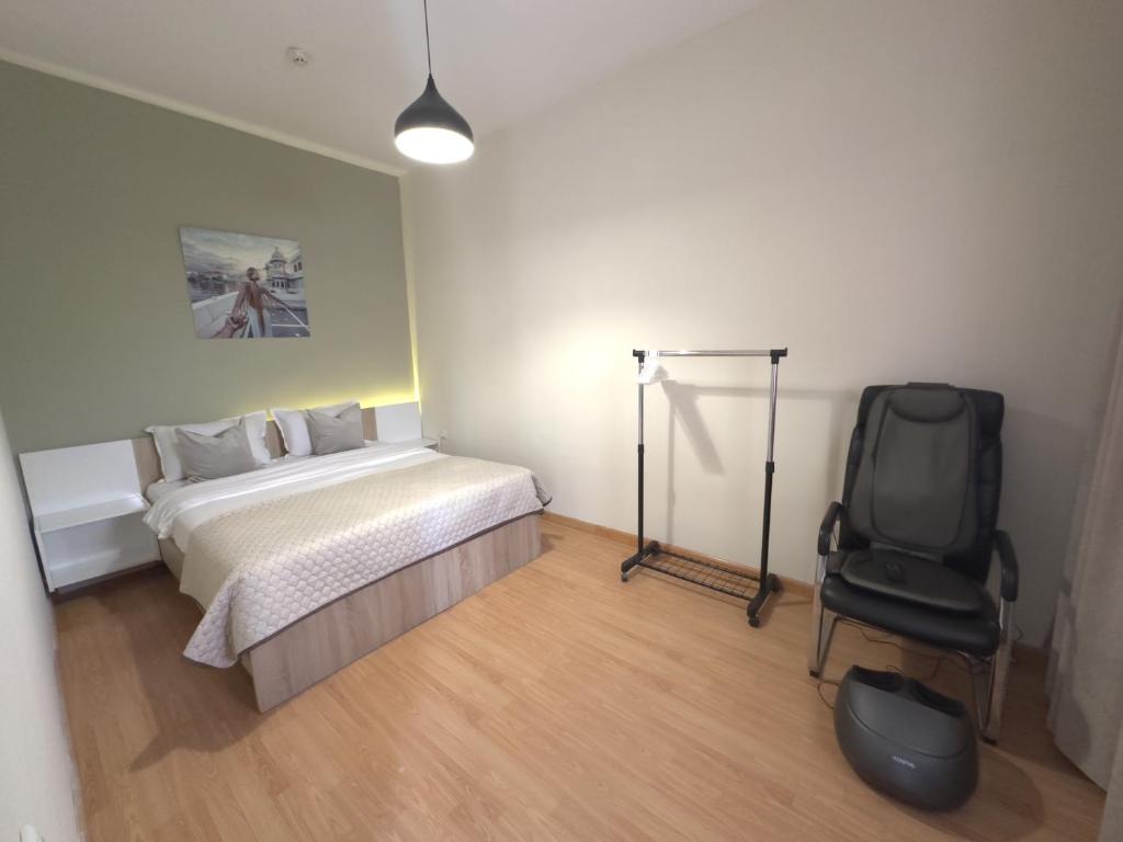 Postel nebo postele na pokoji v ubytování NAVA Hotel Yerevan
