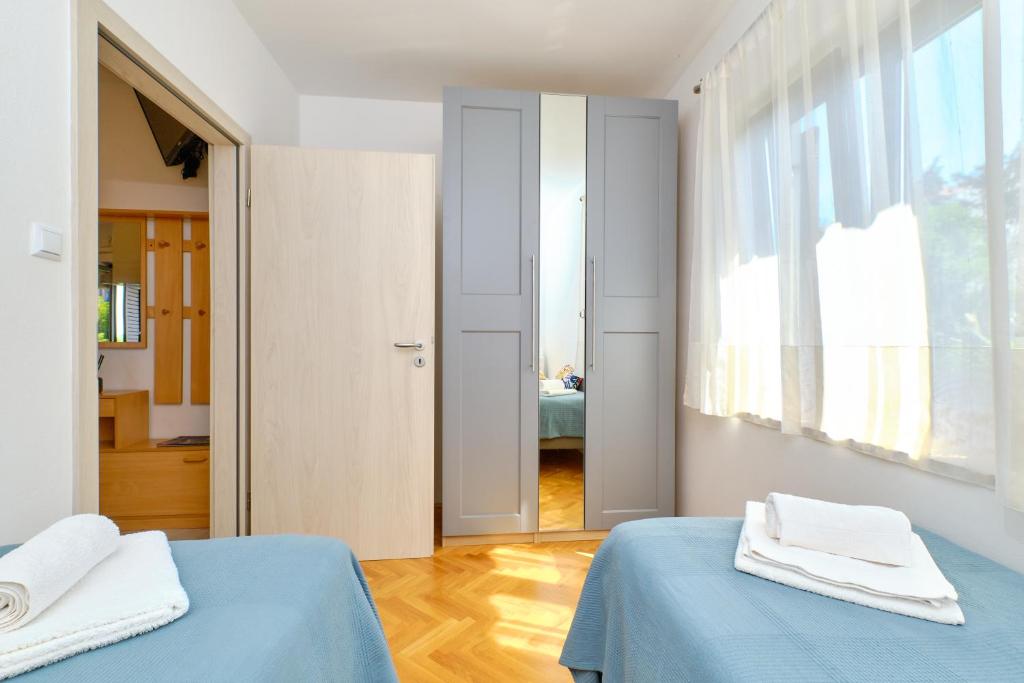 Postel nebo postele na pokoji v ubytování Argo Apartmani