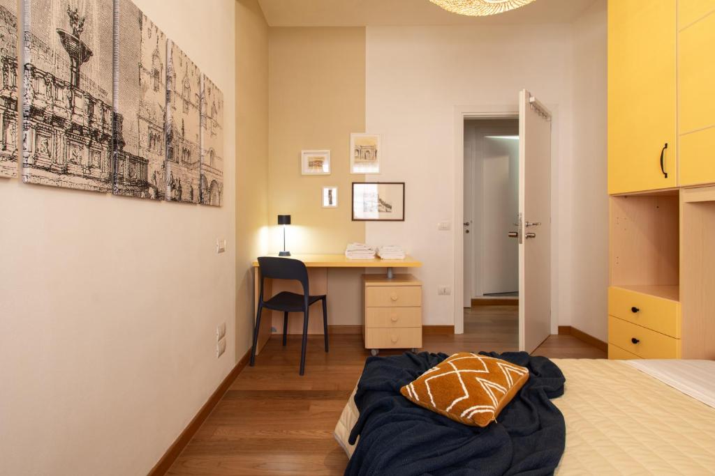 Postel nebo postele na pokoji v ubytování WellStay Perugia Downtown