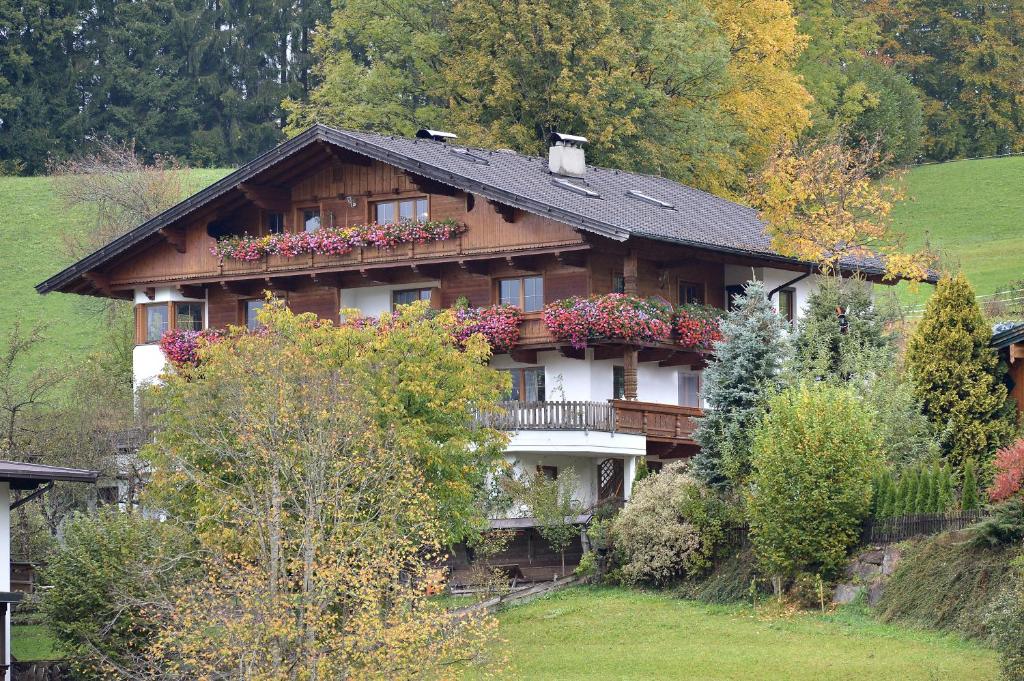 a house with flowers on the side of it at Haus Sonnenschein in Thiersee