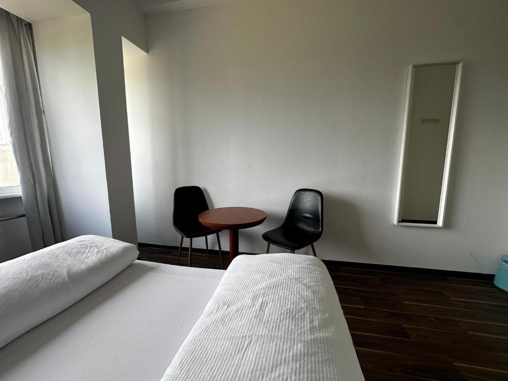 Postel nebo postele na pokoji v ubytování Ootel.com