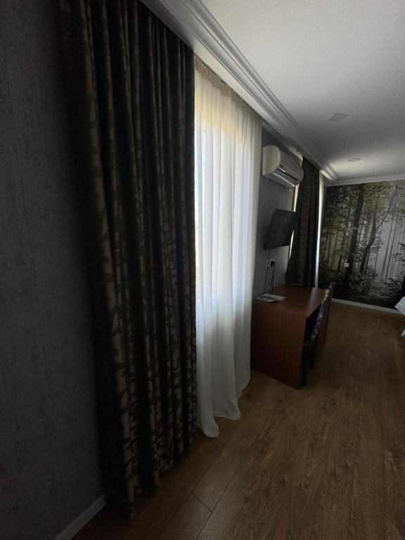 TV a/nebo společenská místnost v ubytování Hotel Kalanga