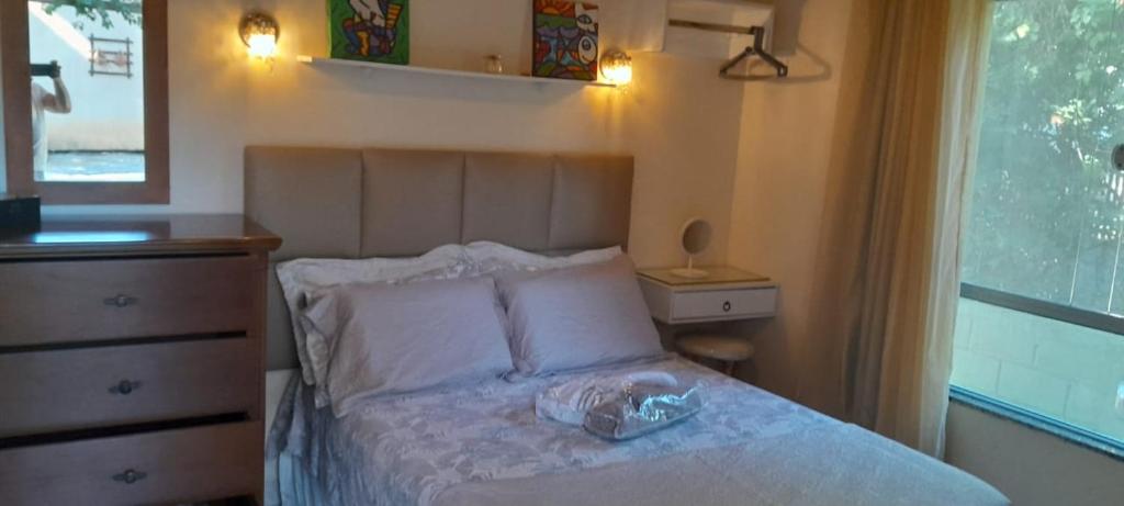Krevet ili kreveti u jedinici u objektu Casa de hospedes em condominio com lazer
