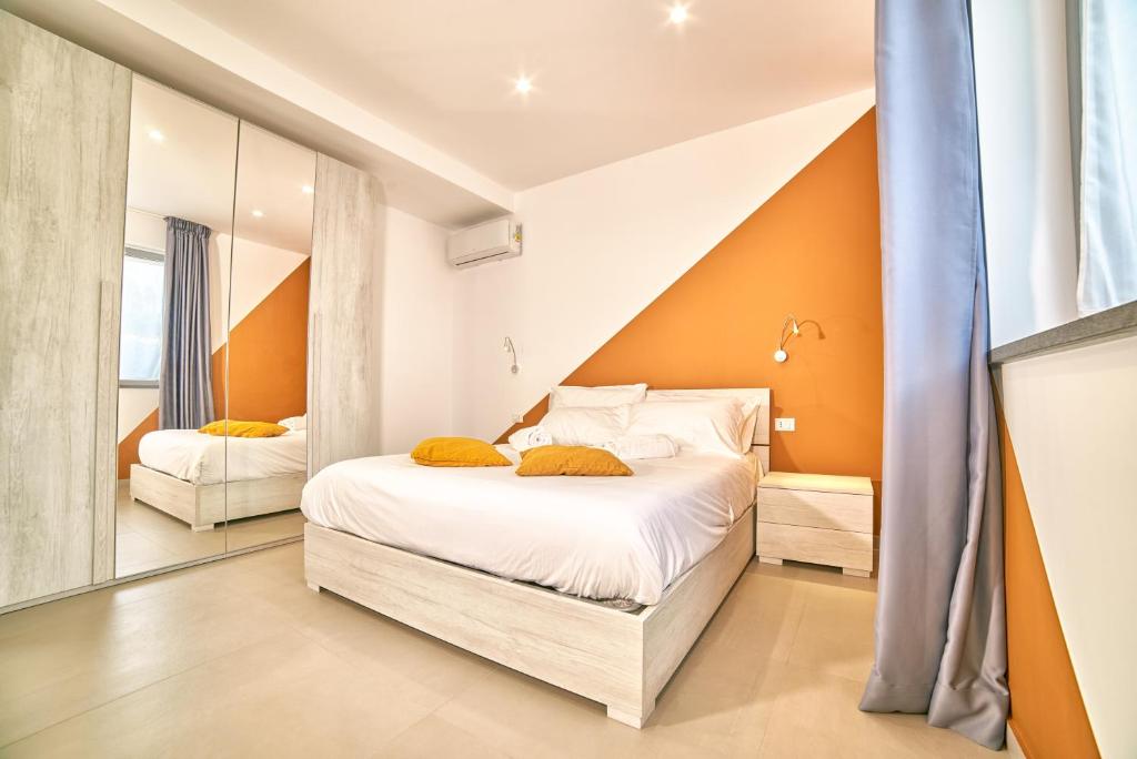 A bed or beds in a room at Il Casale di Monacella