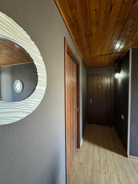 a room with a hallway with a wooden ceiling at Hotel Kalanga in Tbilisi City