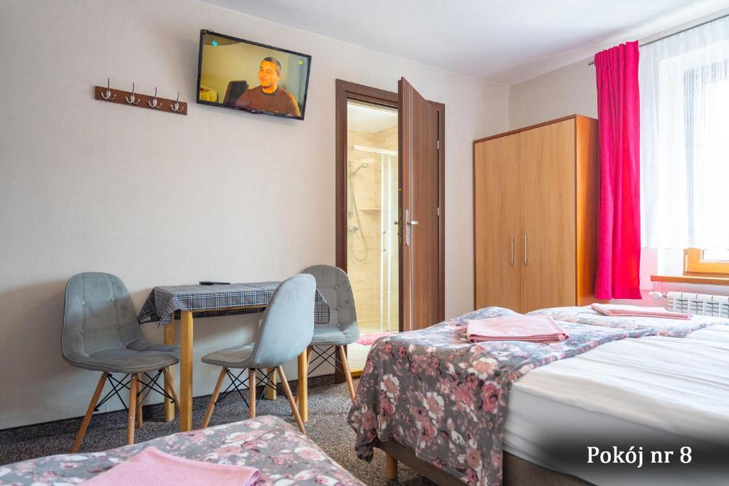 Postel nebo postele na pokoji v ubytování Willa Puchatek
