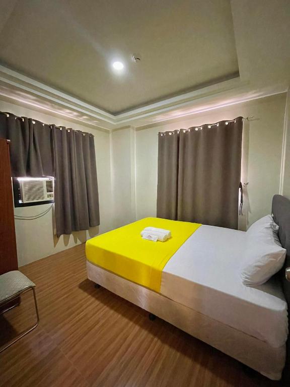 Postel nebo postele na pokoji v ubytování Hotel Elegant La Union