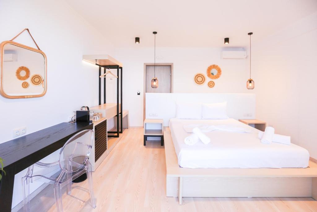 Postel nebo postele na pokoji v ubytování Anassa Suites