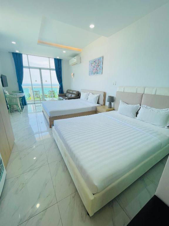 Giường trong phòng chung tại Sealiks Ocean vita muine C326