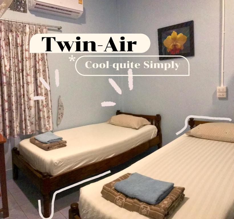 Postel nebo postele na pokoji v ubytování Vitoonguesthouse2fanrooms & Aircondition
