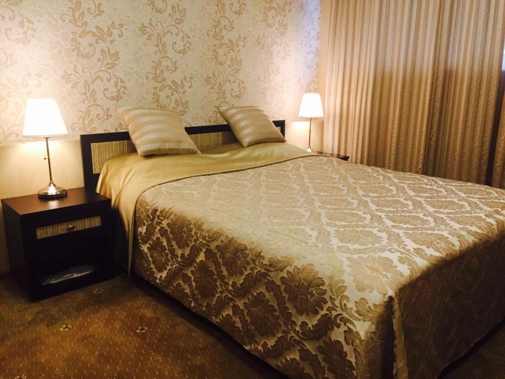 
Кровать или кровати в номере Мини-отель Барский 
