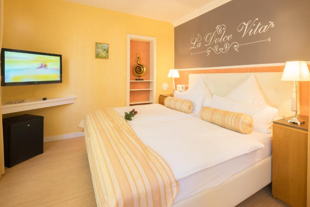 Postel nebo postele na pokoji v ubytování Central Boutique Hotel