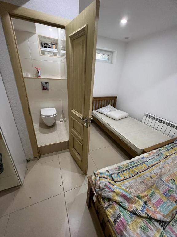 Postel nebo postele na pokoji v ubytování Rest House Tbilisi